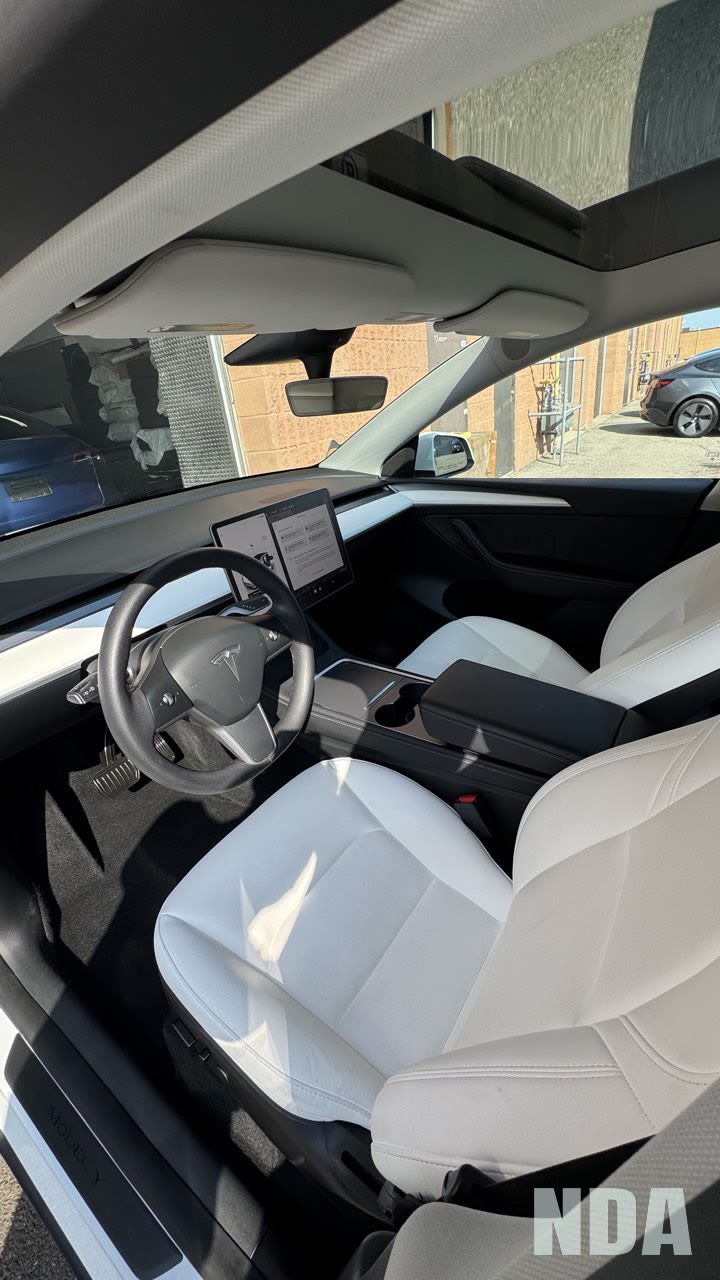 Detailed interior of a white Tesla Model 3