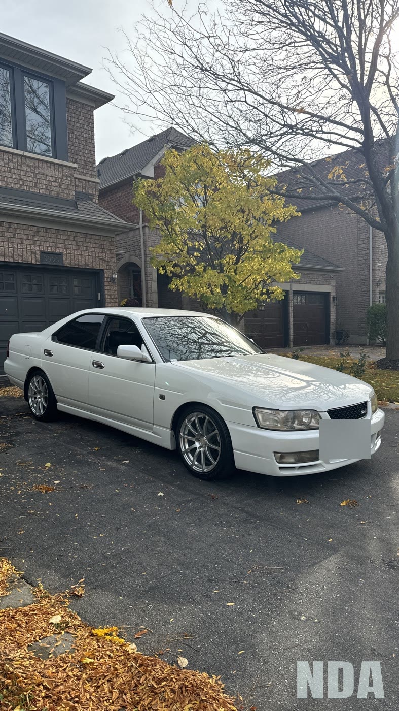 white Nissan Laurel